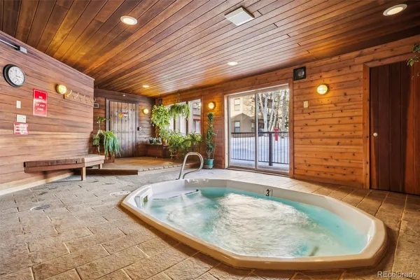 a view of a swimming pool with outdoor seating