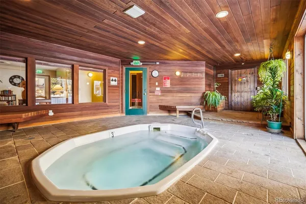 a swimming pool with outdoor seating