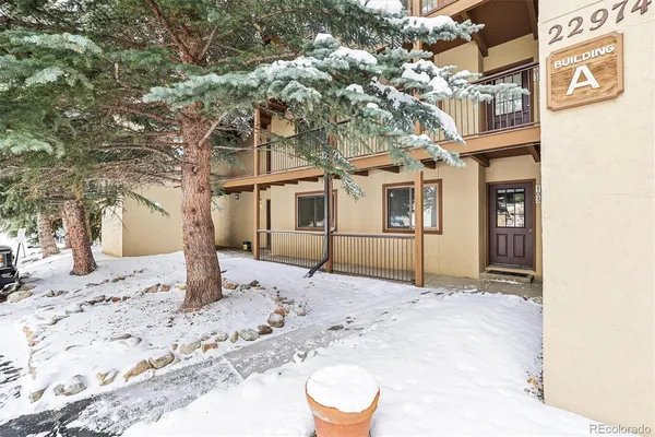a view of a house with a snow in the yard