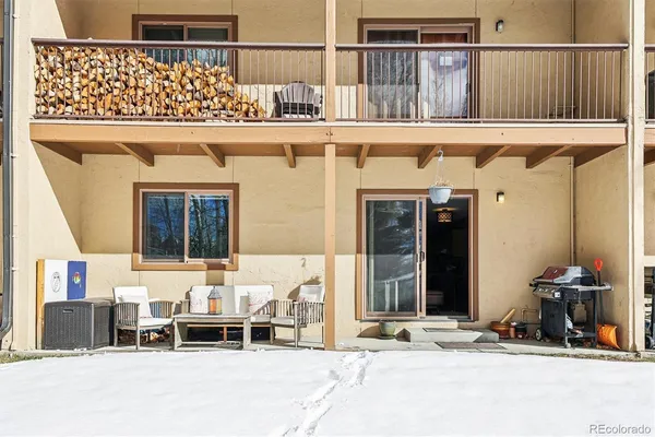 a view of a balcony with furniture