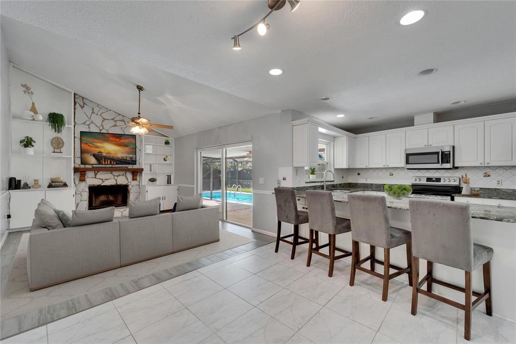 9403 Bellhaven Street Temple Terrace, FL 33637 - Photo 20 of 59 a living room with furniture and a flat screen tv