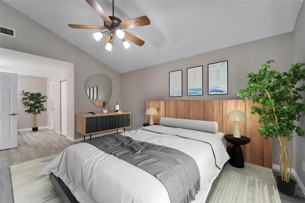 9403 Bellhaven Street Temple Terrace, FL 33637 - Photo 24 of 59 a bedroom with a large bed a chandelier and a potted plant