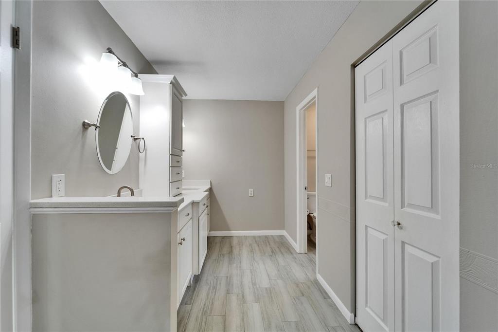 9403 Bellhaven Street Temple Terrace, FL 33637 - Photo 25 of 59 a view of a bathroom sink and a mirror