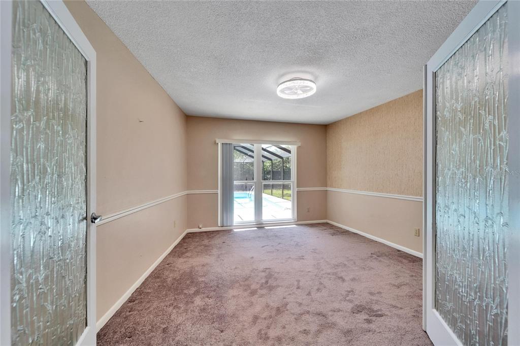 9403 Bellhaven Street Temple Terrace, FL 33637 - Photo 30 of 59 a view of an empty room with a window