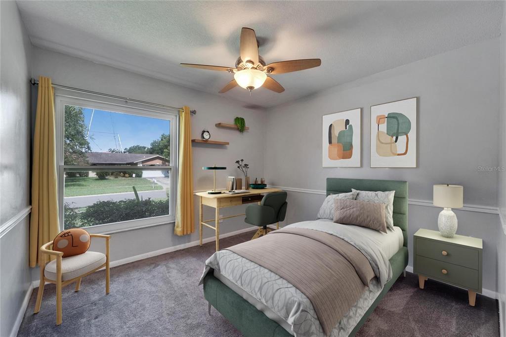 9403 Bellhaven Street Temple Terrace, FL 33637 - Photo 33 of 59 a bedroom with a bed and a chandelier