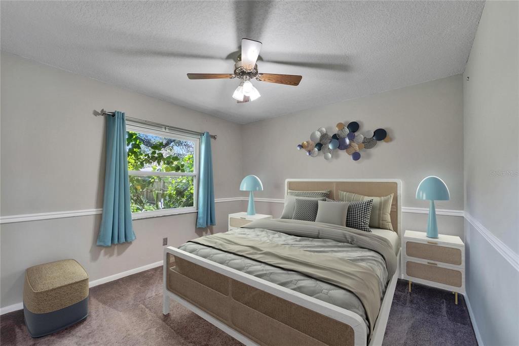 9403 Bellhaven Street Temple Terrace, FL 33637 - Photo 36 of 59 a bedroom with a bed and a window