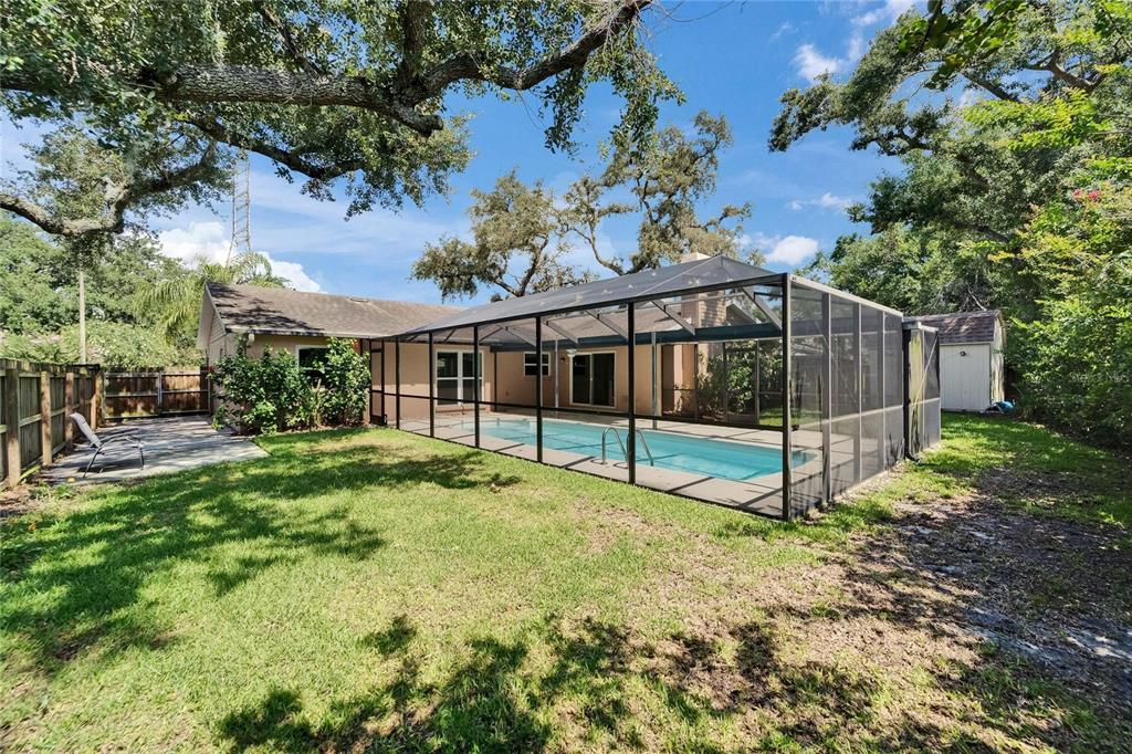 9403 Bellhaven Street Temple Terrace, FL 33637 - Photo 49 of 59 a view of a house with backyard and porch