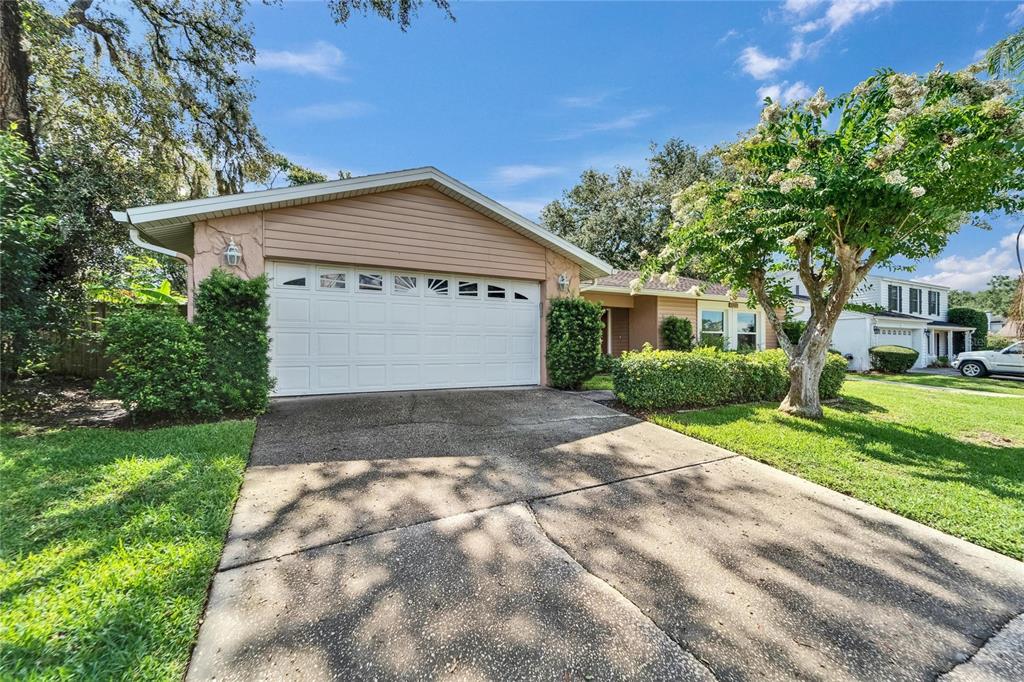 9403 Bellhaven Street Temple Terrace, FL 33637 - Photo 5 of 59 a view of garage and yard
