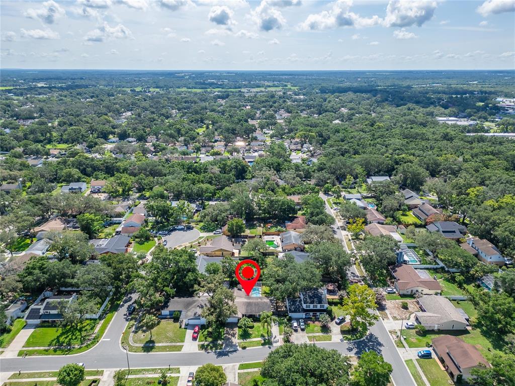 9403 Bellhaven Street Temple Terrace, FL 33637 - Photo 56 of 59 an aerial view of residential house and outdoor space