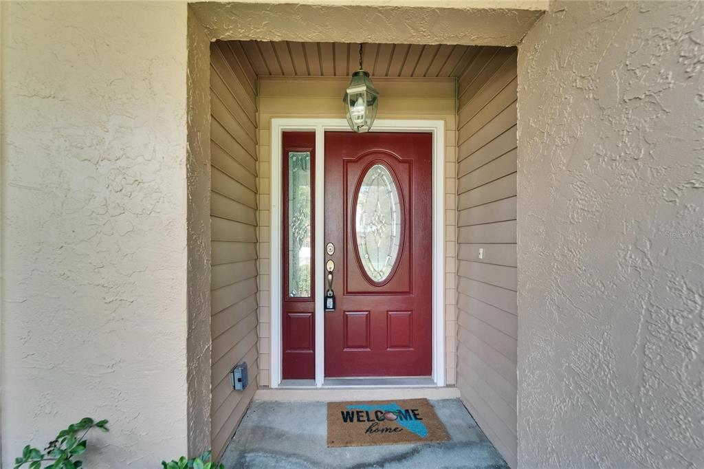9403 Bellhaven Street Temple Terrace, FL 33637 - Photo 7 of 59 a view of a door of a house with a small cabin