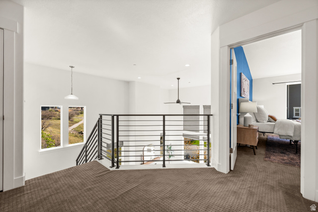 14728 South Canyon Pointe Road Draper, UT 84020 - Photo 20 of 35 Upper-level landing featuring a contemporary horizontal bar railing and carpeted flooring