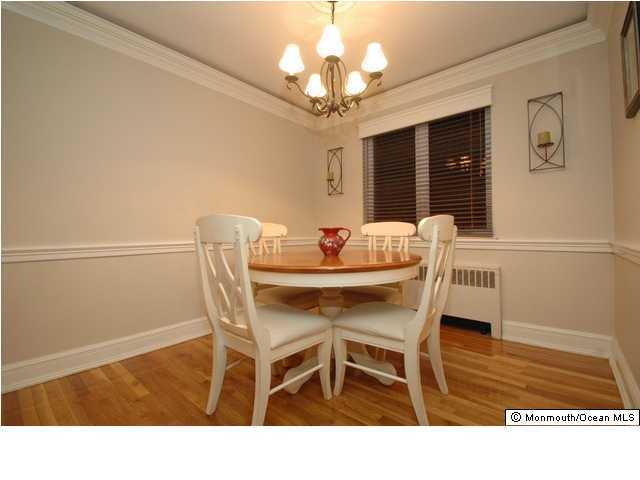 283 Spring Street, Unit 7C Red Bank, NJ 07701 - Photo 1 of 3 a dining room with furniture and window