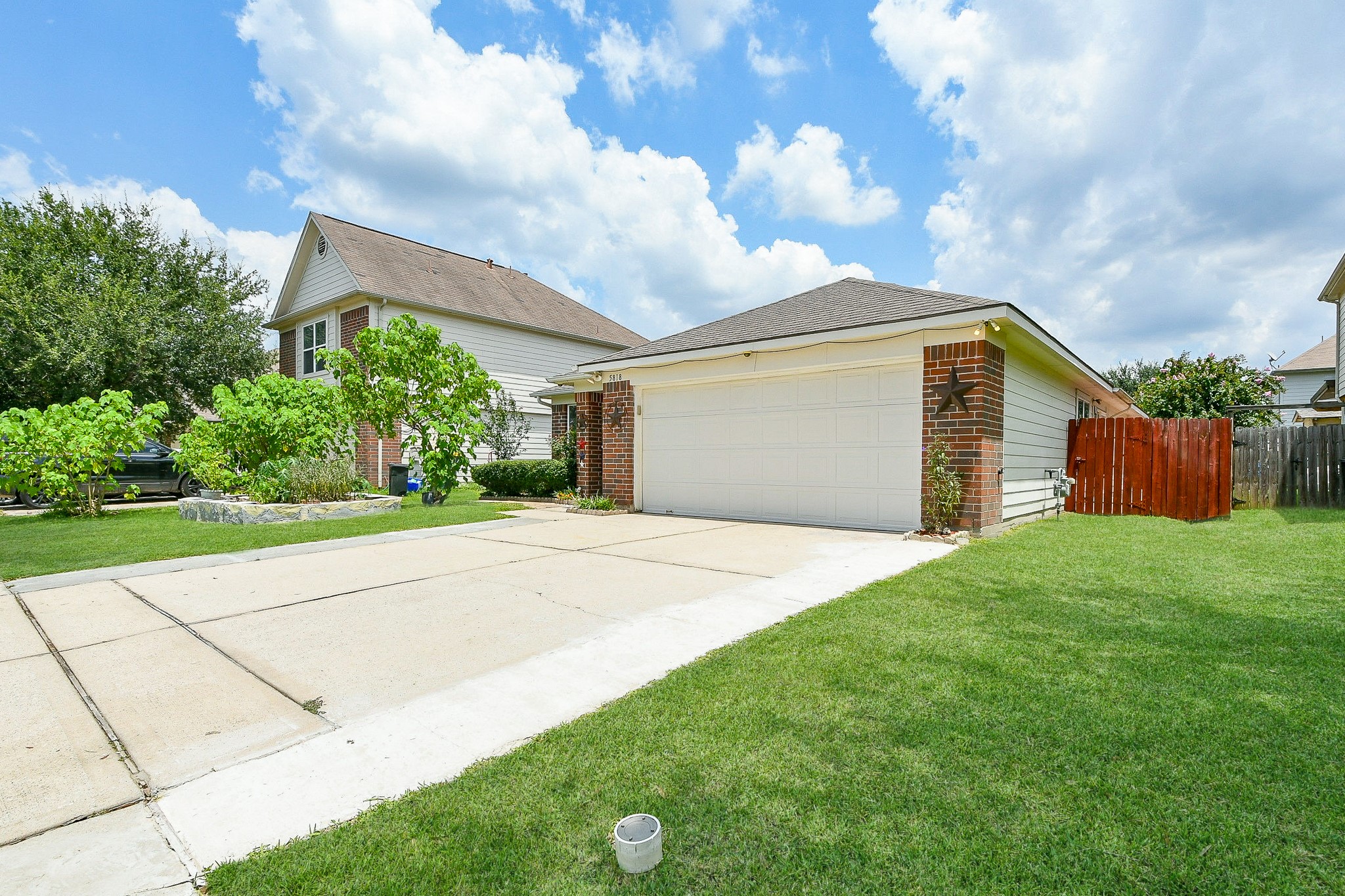 a view of backyard of house and garage