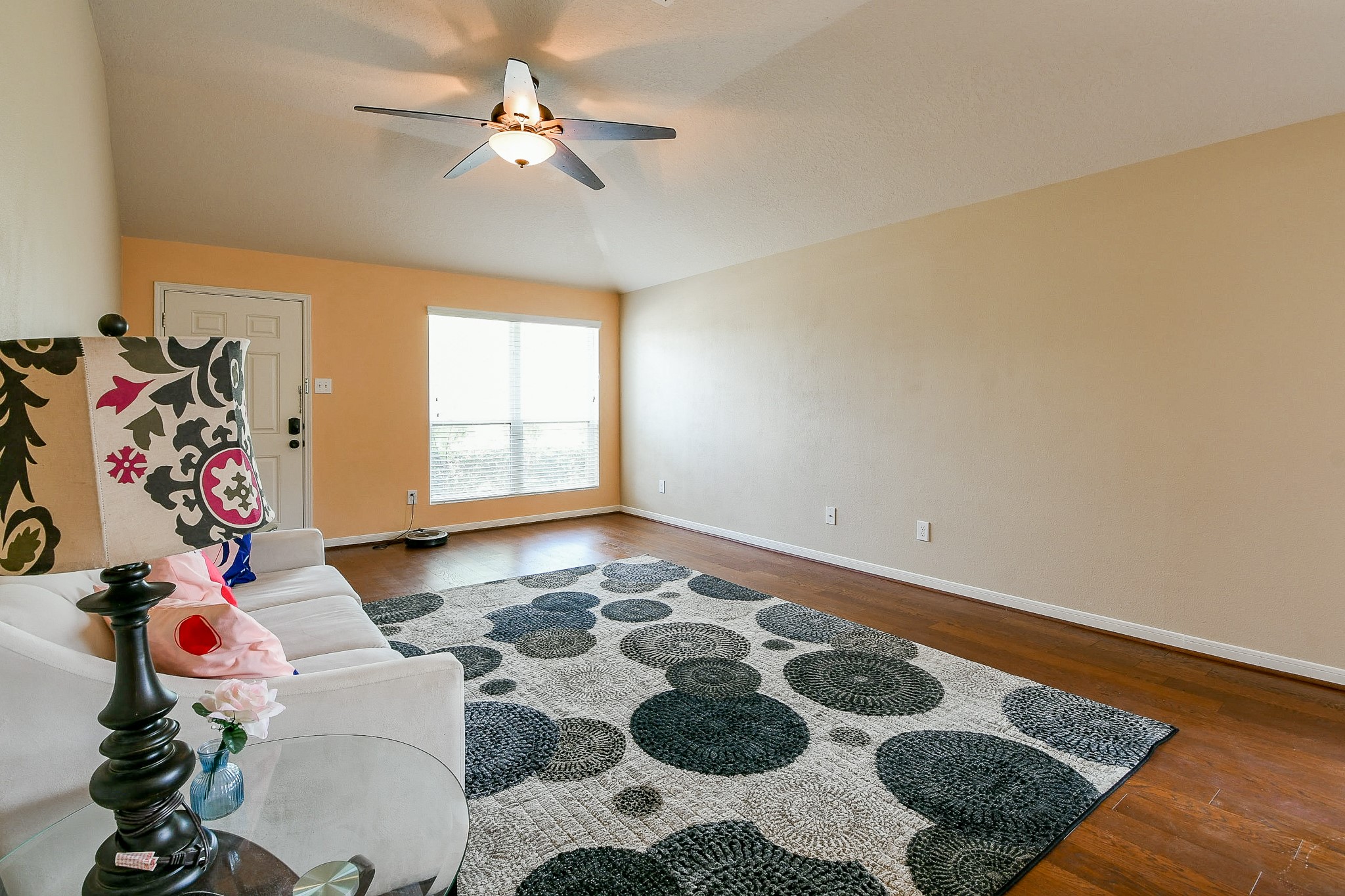 5818 Turmeric Drive Baytown, TX 77521 - Photo 11 of 50 a living room with a rug and a chandelier