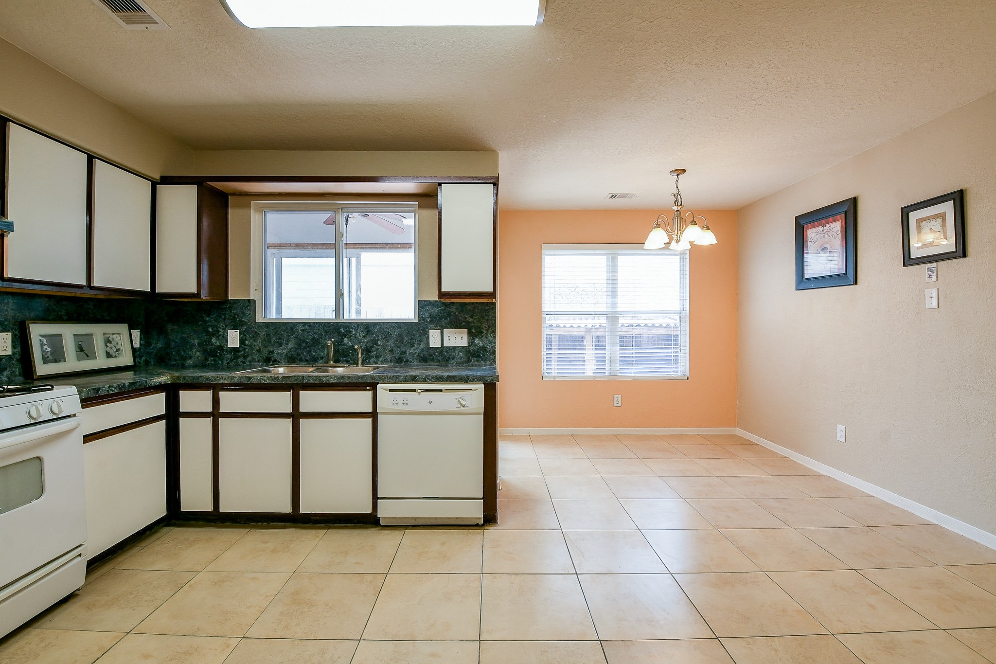 5818 Turmeric Drive Baytown, TX 77521 - Photo 18 of 50 a kitchen with a white cabinets and window