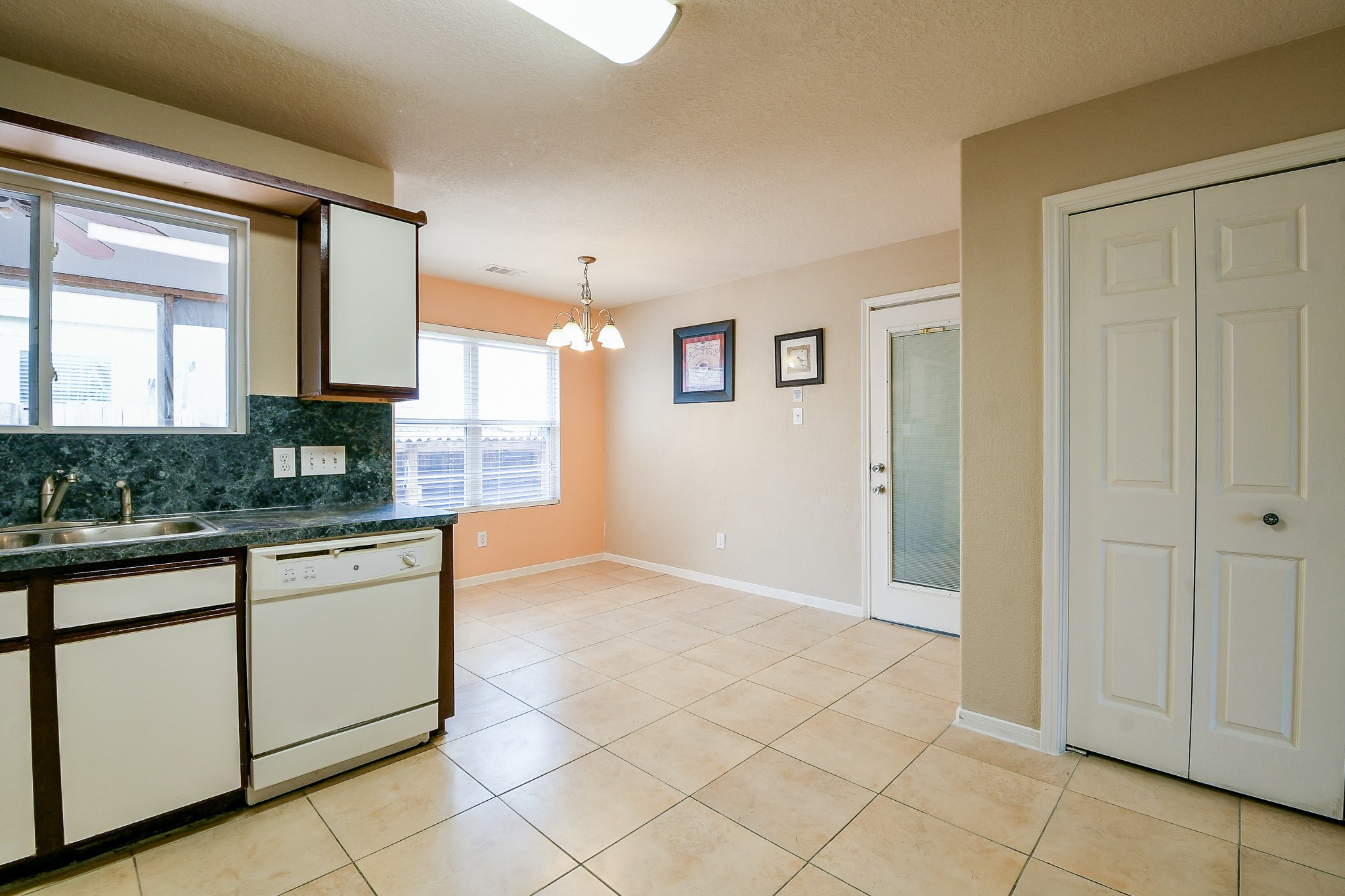 5818 Turmeric Drive Baytown, TX 77521 - Photo 19 of 50 a kitchen with stainless steel appliances granite countertop a refrigerator and a granite counter tops