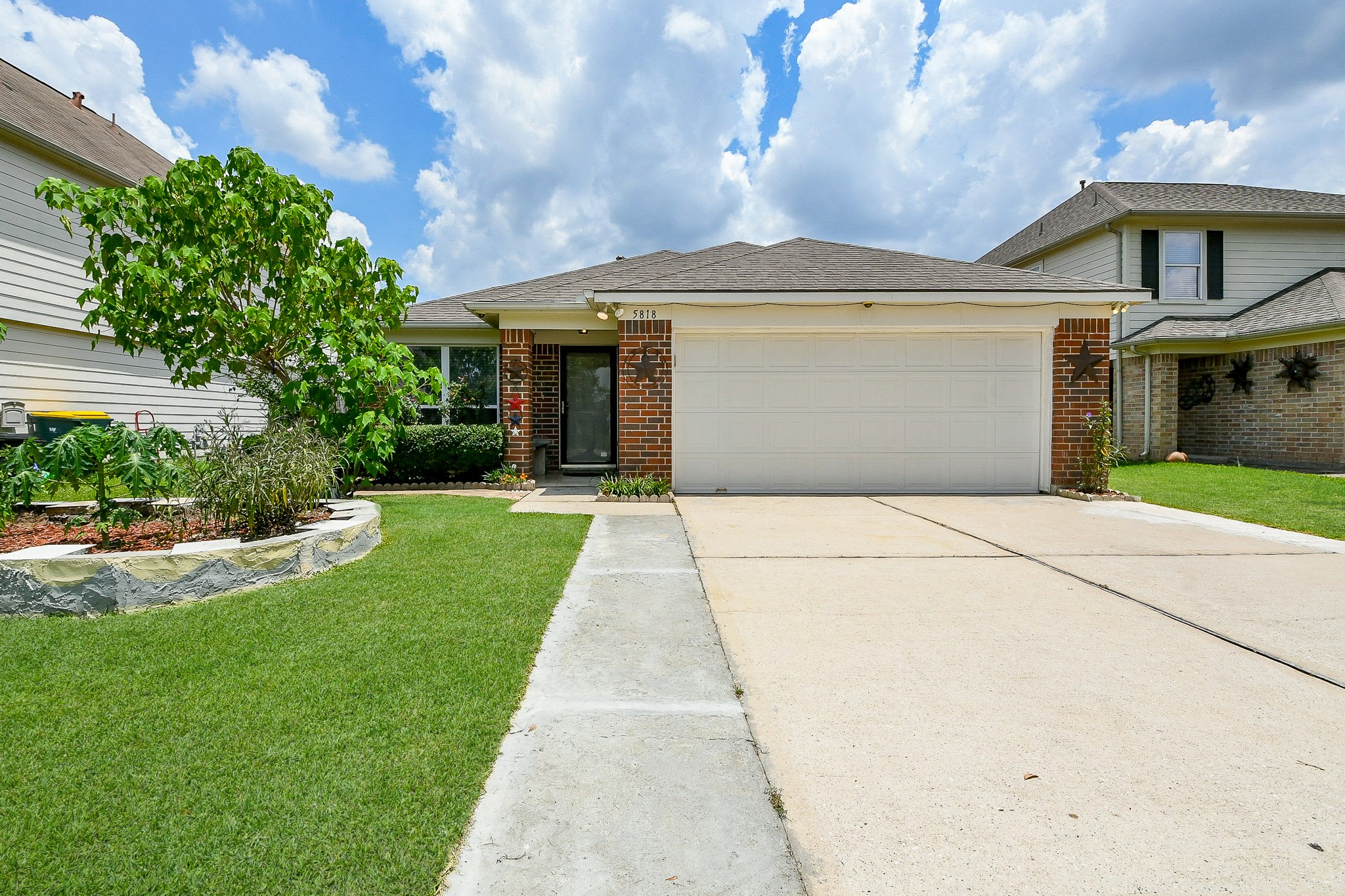 5818 Turmeric Drive Baytown, TX 77521 - Photo 2 of 50 a front view of a house with a yard and garage