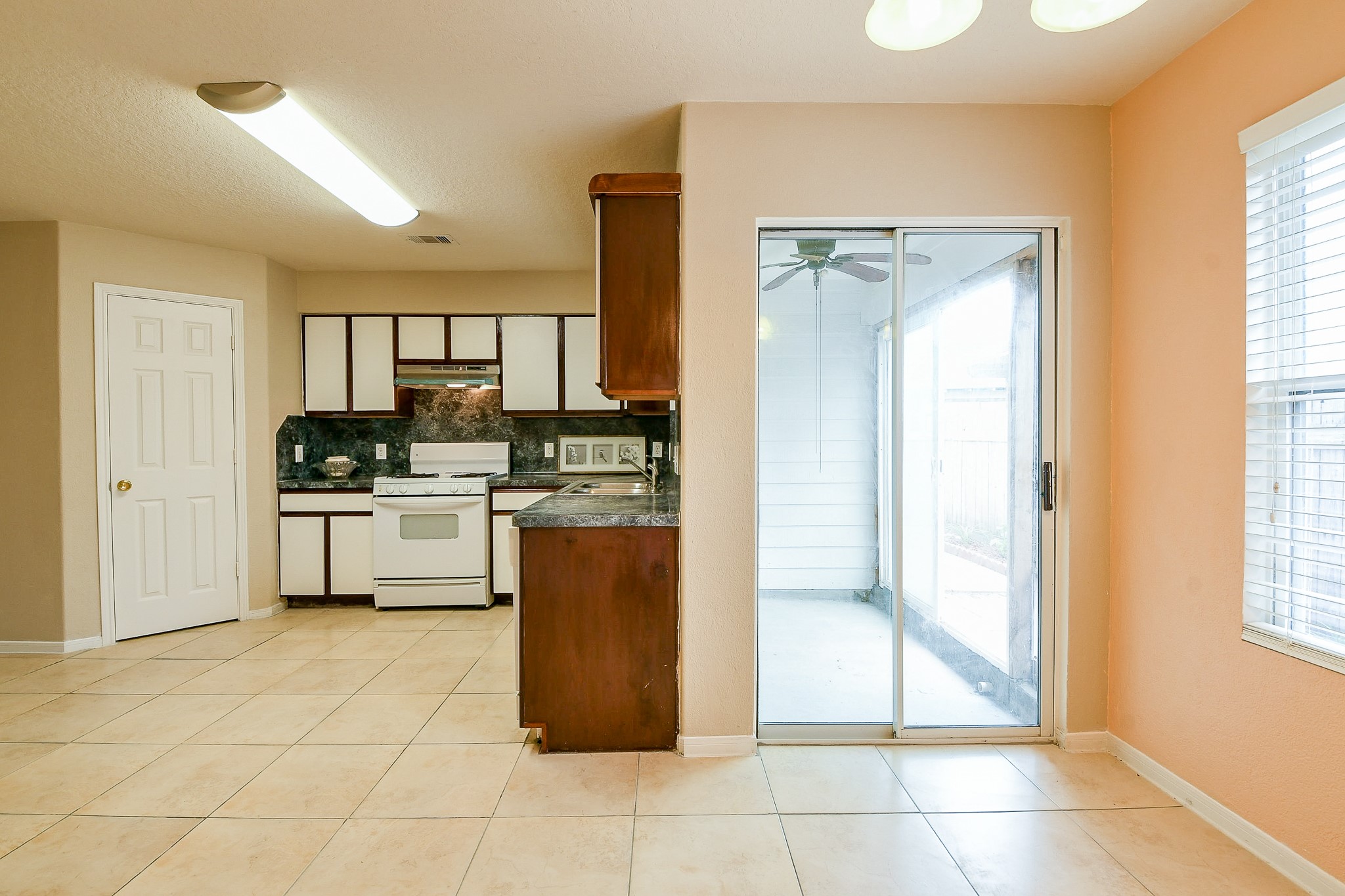 5818 Turmeric Drive Baytown, TX 77521 - Photo 27 of 50 a kitchen with stainless steel appliances a refrigerator sink and cabinets