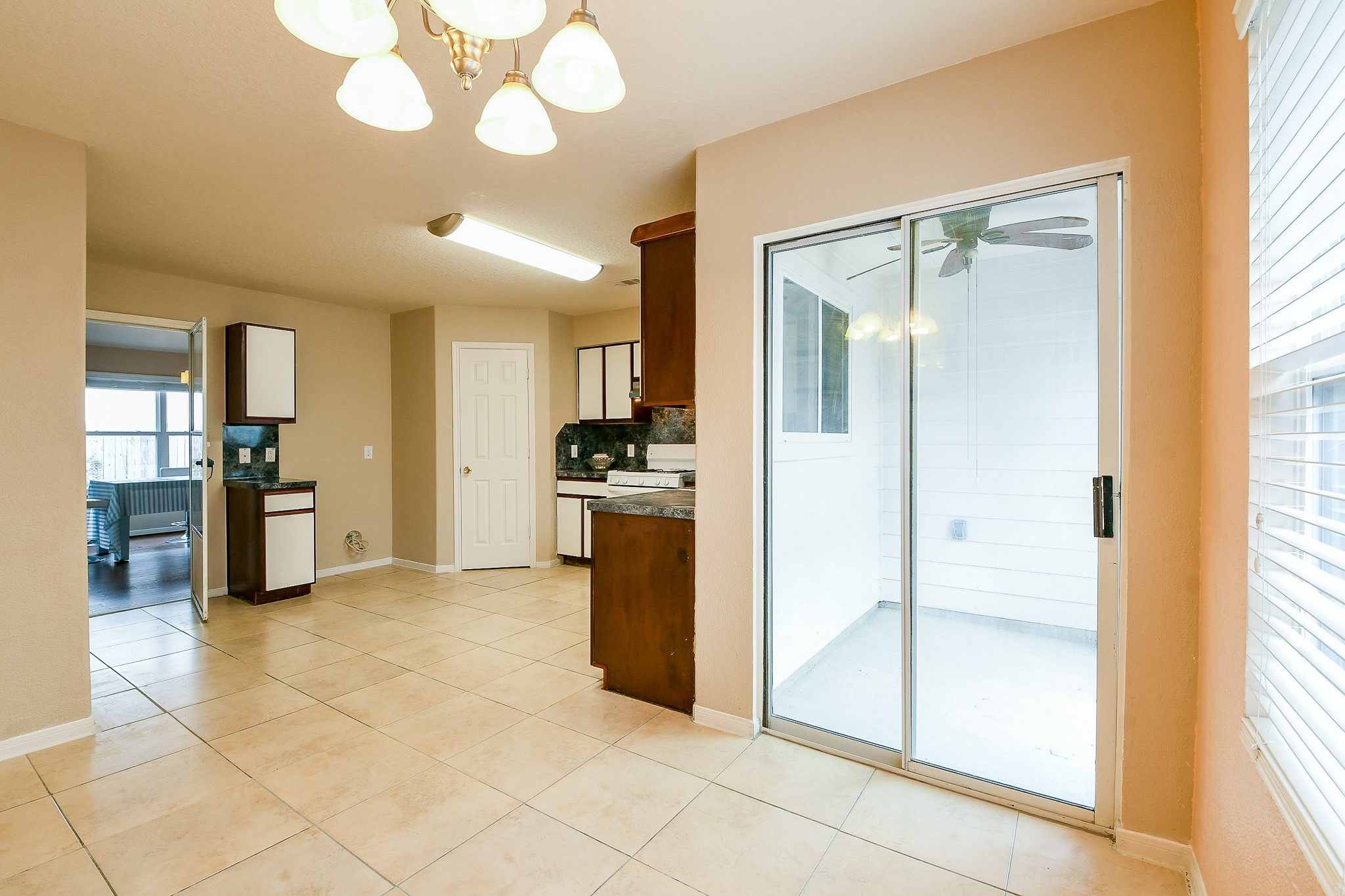 5818 Turmeric Drive Baytown, TX 77521 - Photo 28 of 50 a view of a kitchen with a refrigerator and a stove top oven