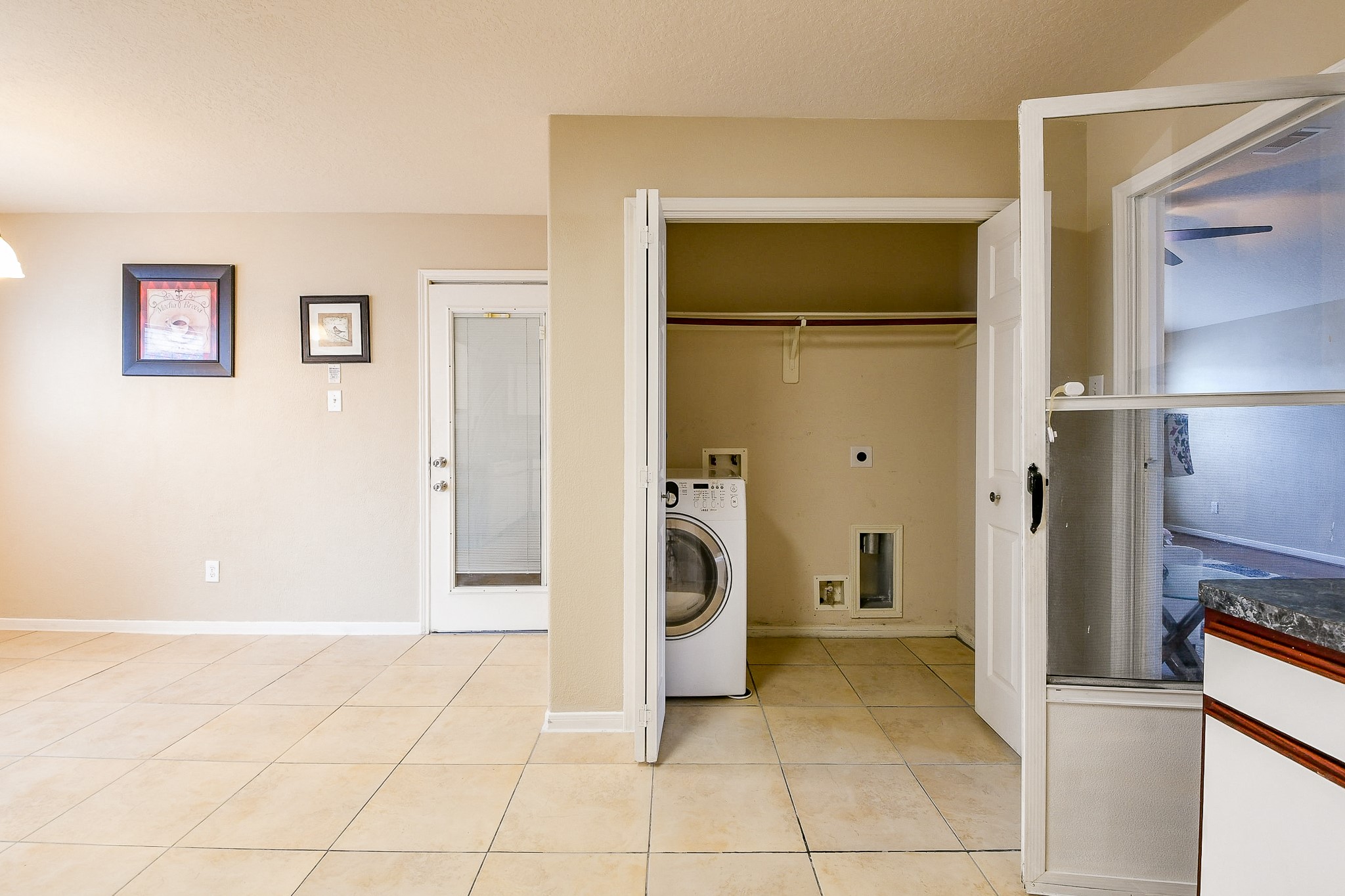 5818 Turmeric Drive Baytown, TX 77521 - Photo 29 of 50 a view of a storage & utility room with refrigerator and mirror