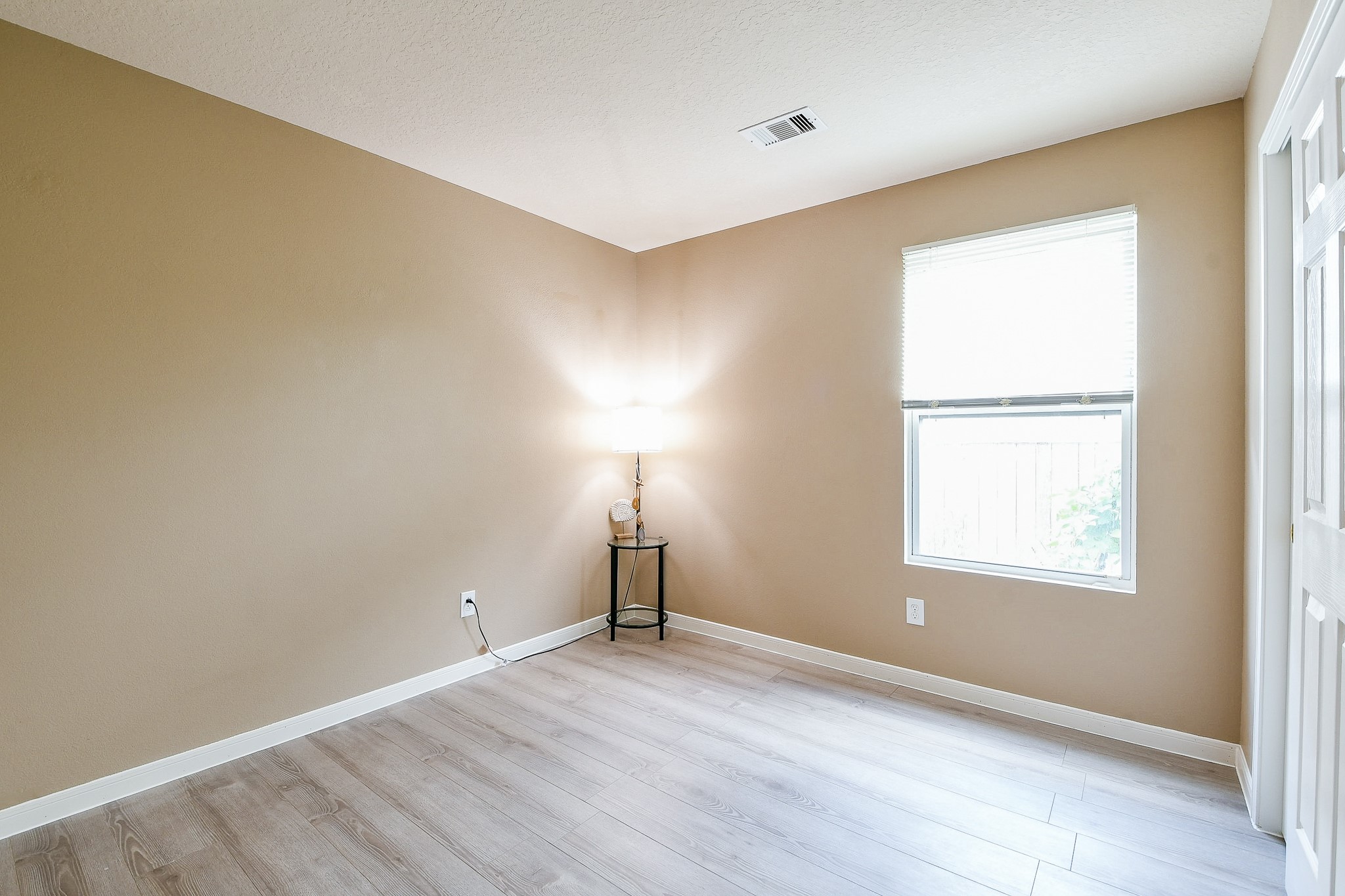 5818 Turmeric Drive Baytown, TX 77521 - Photo 33 of 50 an empty room with wooden floor and windows