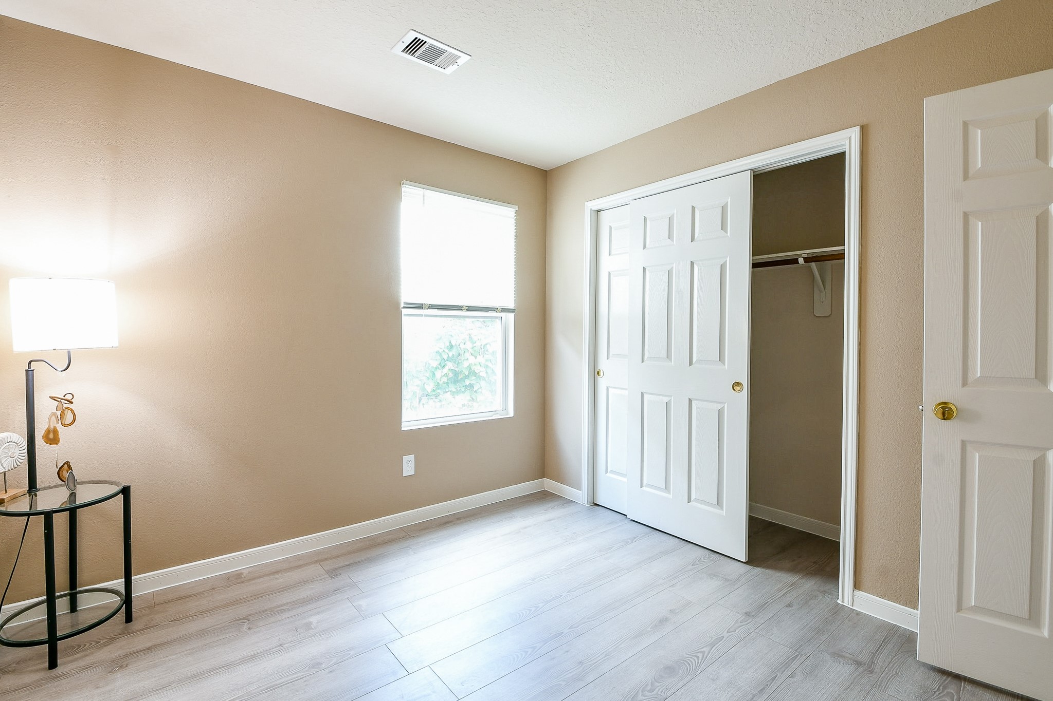 5818 Turmeric Drive Baytown, TX 77521 - Photo 35 of 50 a view of an empty room with wooden floor and a window