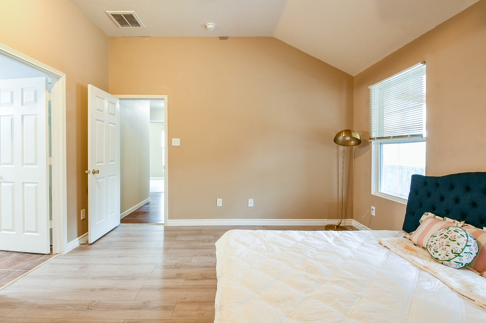 5818 Turmeric Drive Baytown, TX 77521 - Photo 42 of 50 a bedroom with a bed and wooden floor