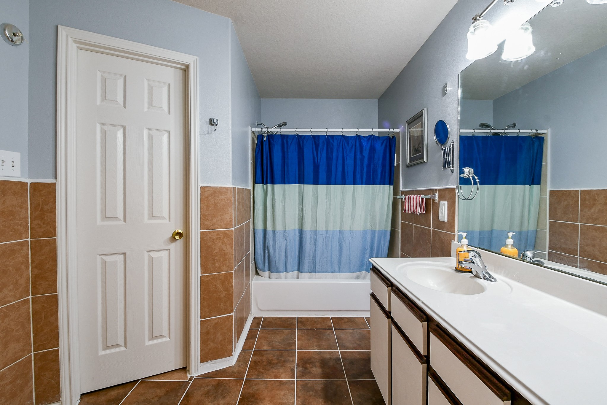 5818 Turmeric Drive Baytown, TX 77521 - Photo 43 of 50 a bathroom with a sink and a mirror