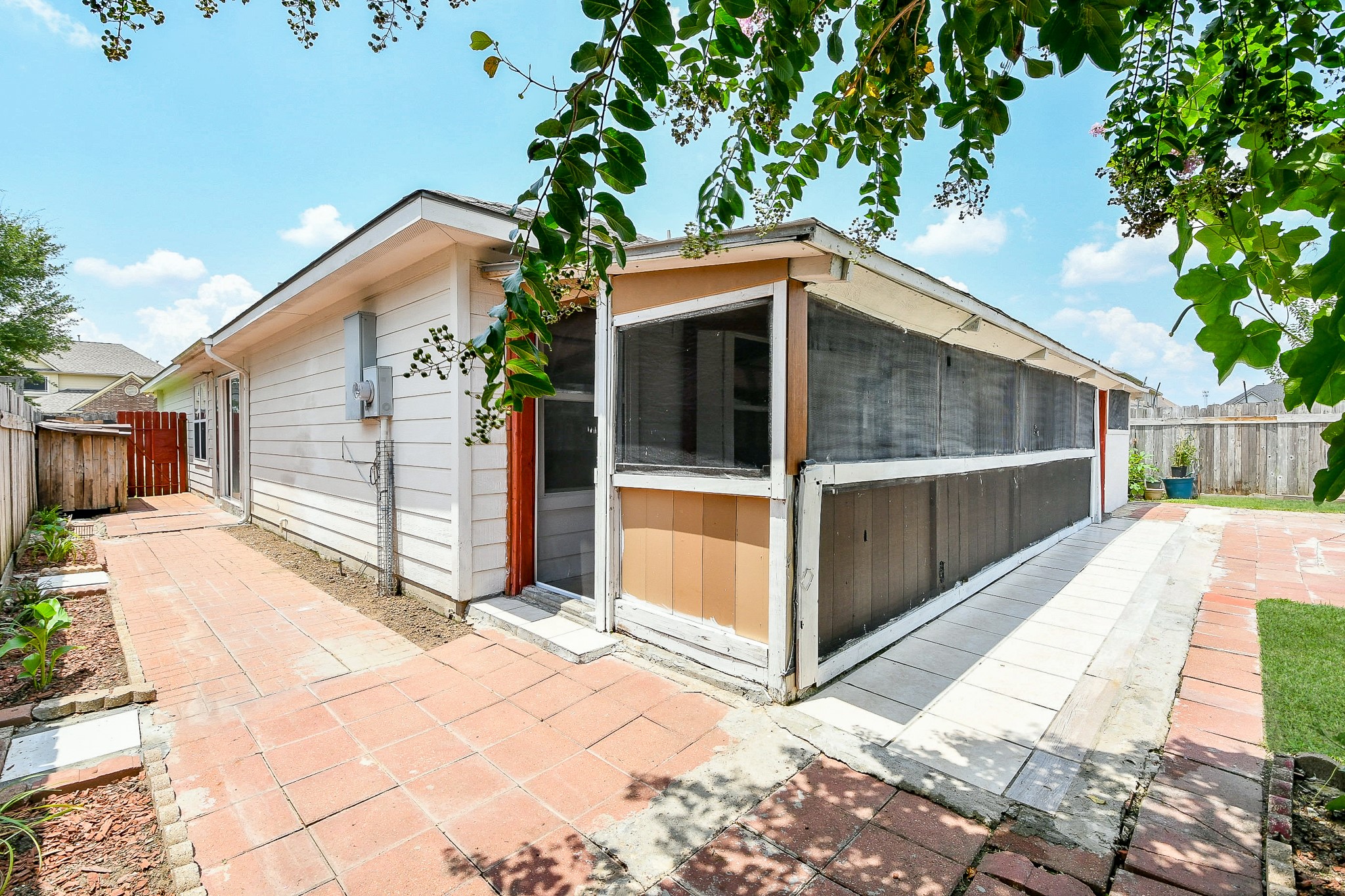 5818 Turmeric Drive Baytown, TX 77521 - Photo 47 of 50 a view of backyard with a large tree and wooden fence