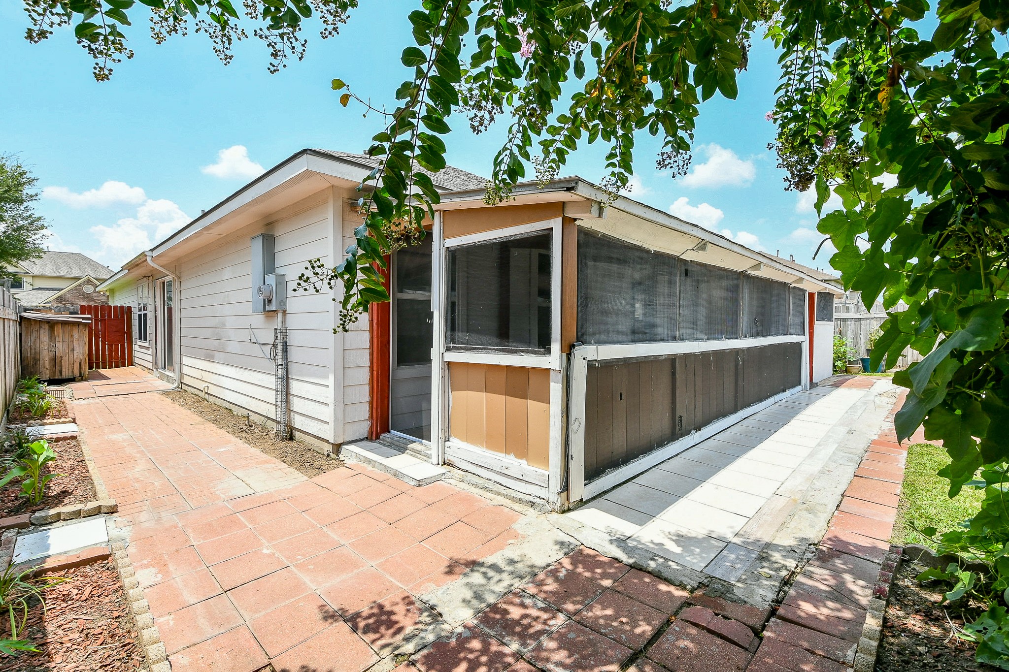 5818 Turmeric Drive Baytown, TX 77521 - Photo 49 of 50 a view of backyard with a large tree and wooden fence