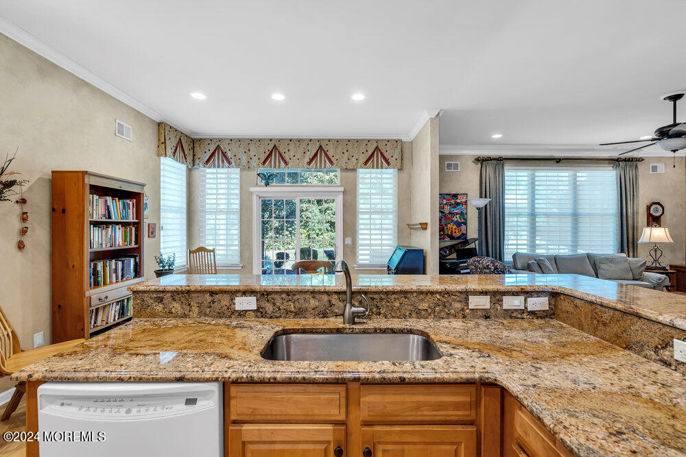 27 Exeter Drive Freehold, NJ 07728 - Photo 14 of 55 a kitchen with sink refrigerator and window