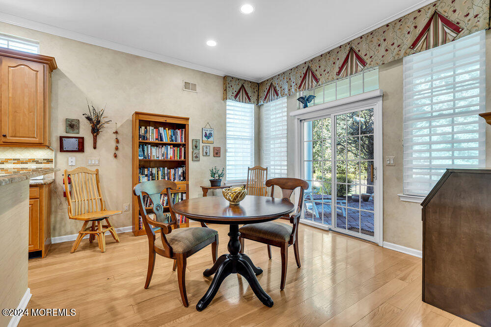 27 Exeter Drive Freehold, NJ 07728 - Photo 16 of 55 a dining room with furniture and a floor to ceiling window