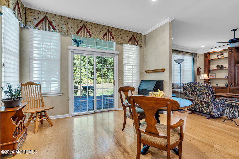 27 Exeter Drive Freehold, NJ 07728 - Photo 17 of 55 a dining room with furniture and wooden floor