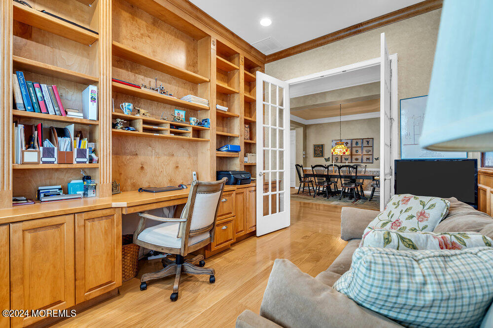27 Exeter Drive Freehold, NJ 07728 - Photo 20 of 55 a living room with furniture and a book shelf