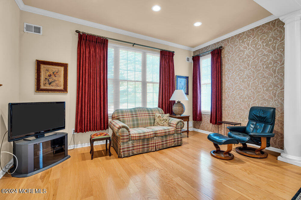 27 Exeter Drive Freehold, NJ 07728 - Photo 22 of 55 a living room with furniture and a flat screen tv