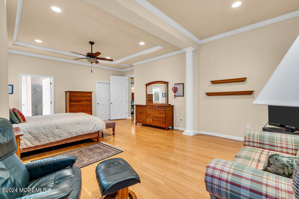 27 Exeter Drive Freehold, NJ 07728 - Photo 23 of 55 a bedroom with furniture and wooden floor
