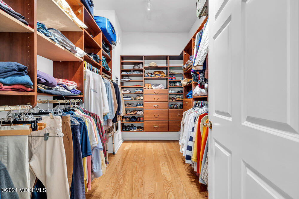 27 Exeter Drive Freehold, NJ 07728 - Photo 25 of 55 a view of walk in closet with clothes and shoes