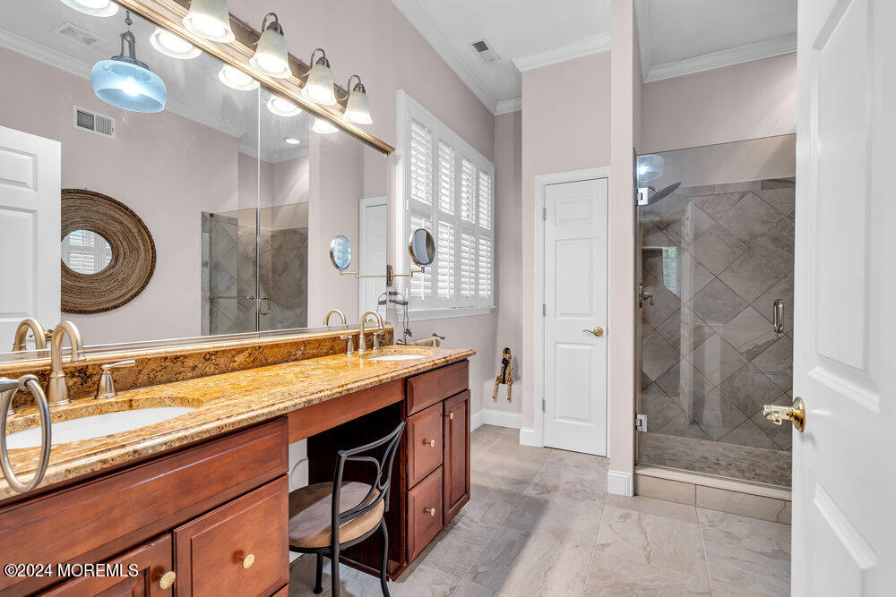 27 Exeter Drive Freehold, NJ 07728 - Photo 26 of 55 a bath room with a sink double vanity and a shower