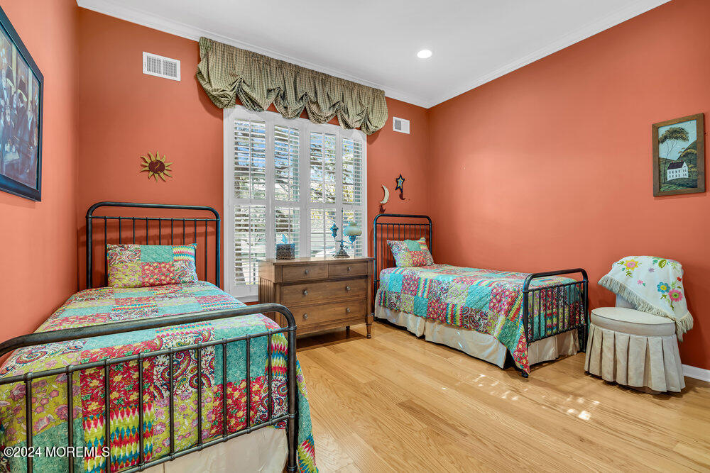 27 Exeter Drive Freehold, NJ 07728 - Photo 30 of 55 a bedroom with two beds and a window