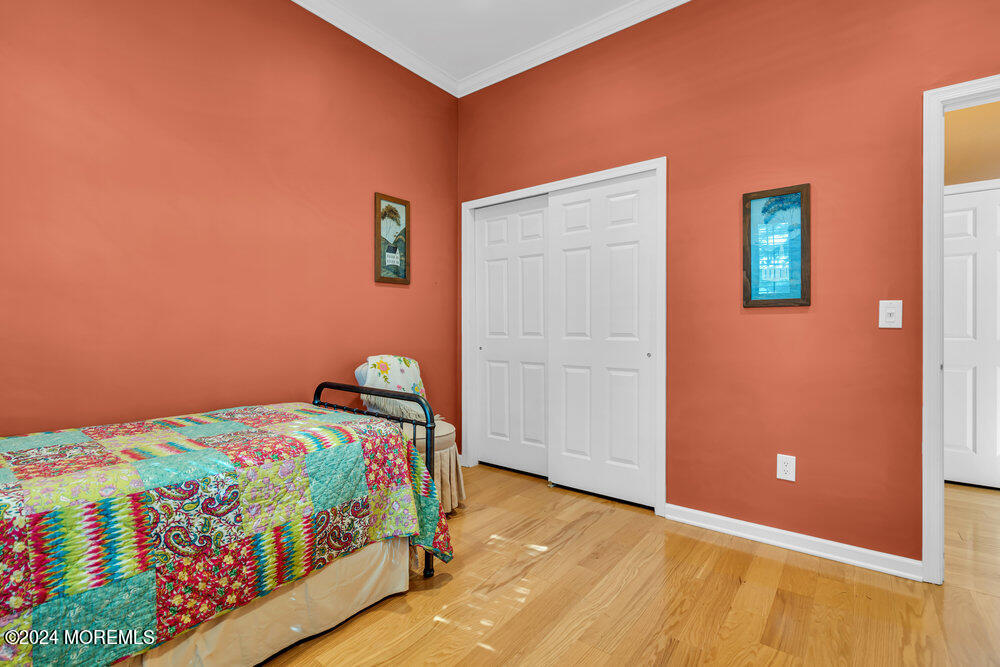 27 Exeter Drive Freehold, NJ 07728 - Photo 31 of 55 a bedroom with a bed and a window