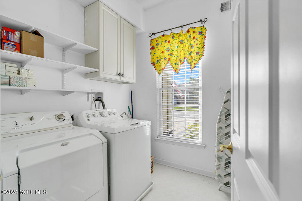 27 Exeter Drive Freehold, NJ 07728 - Photo 33 of 55 a utility room with dryer and washer