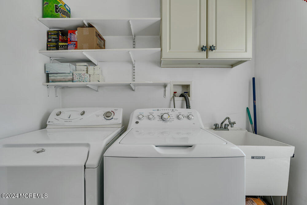 27 Exeter Drive Freehold, NJ 07728 - Photo 34 of 55 a utility room with dryer and washer
