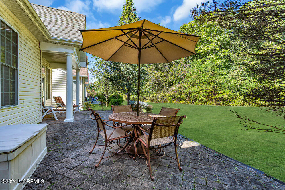 27 Exeter Drive Freehold, NJ 07728 - Photo 40 of 55 a view of a backyard with sitting area and furniture