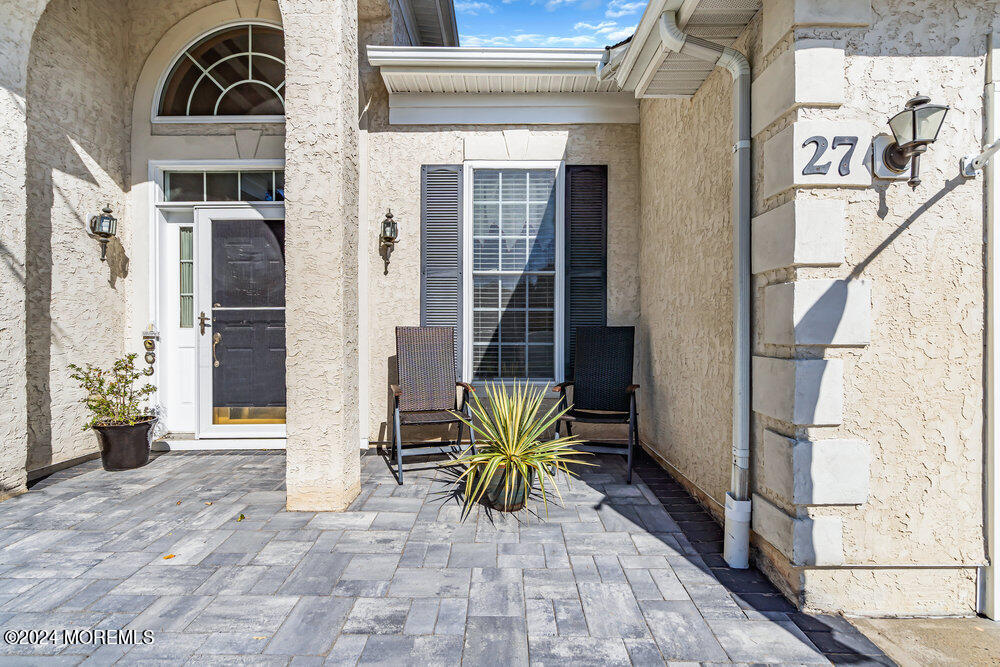 27 Exeter Drive Freehold, NJ 07728 - Photo 4 of 55 a view of a path along with potted plants
