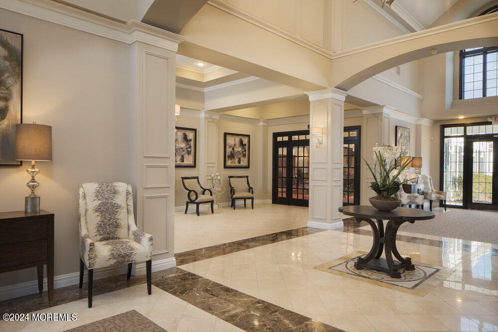 27 Exeter Drive Freehold, NJ 07728 - Photo 45 of 55 a view of a livingroom with furniture and a potted plant