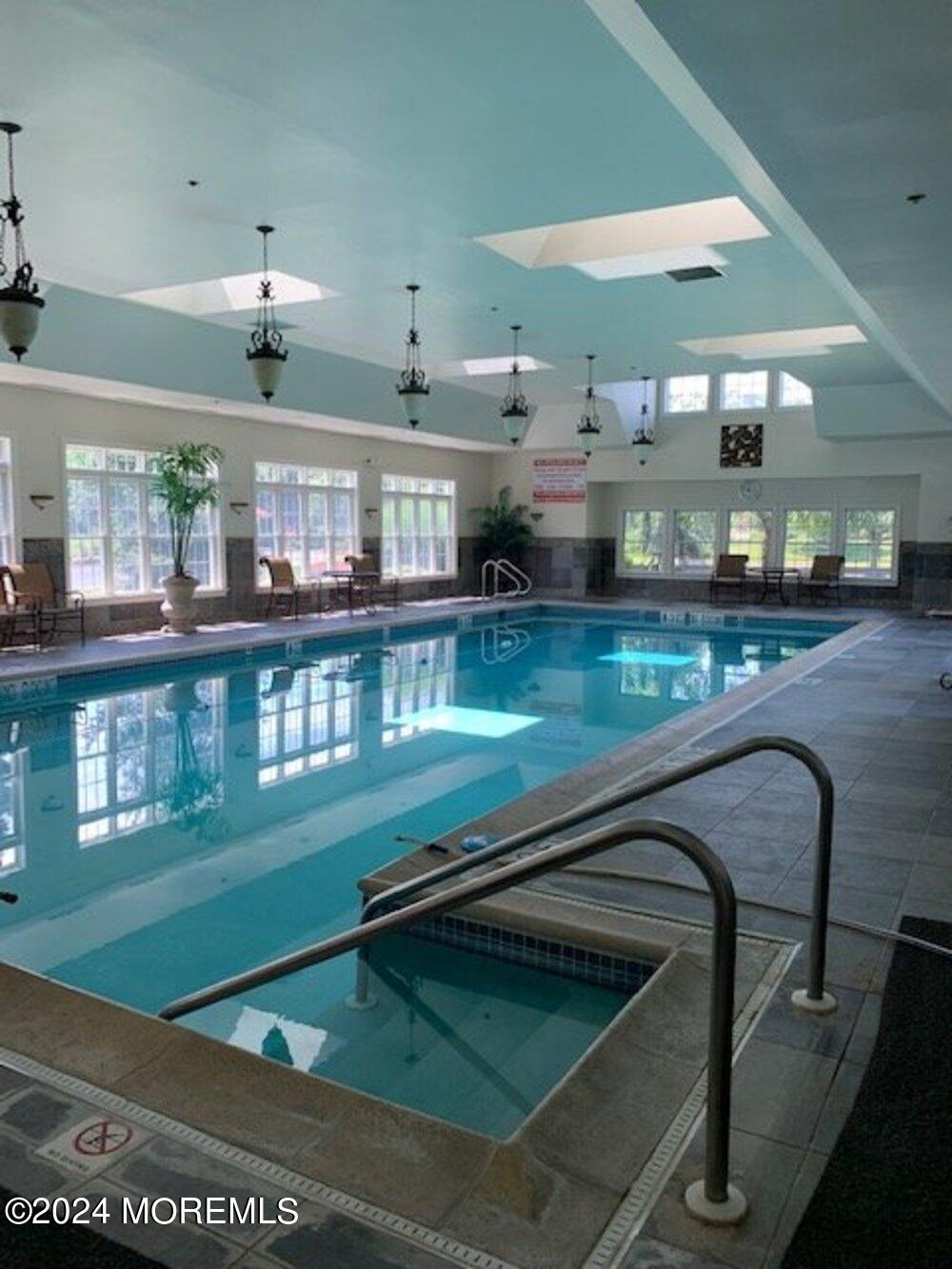 27 Exeter Drive Freehold, NJ 07728 - Photo 52 of 55 a kitchen with stainless steel appliances granite countertop a stove and a view of living room