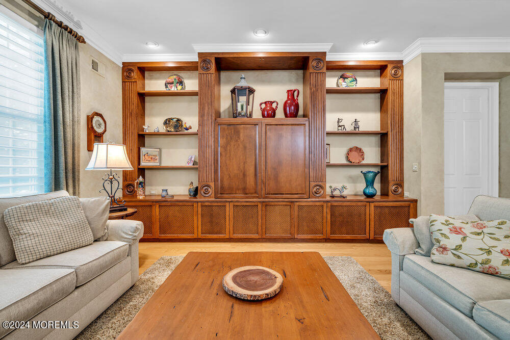27 Exeter Drive Freehold, NJ 07728 - Photo 9 of 55 a living room with furniture and a table