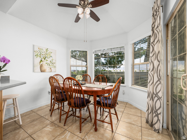 1602 Renaissance Way Springville, UT 84663 - Photo 13 of 42 Dining area featuring bay windows, tile flooring, a ceiling fan, and a sliding glass door