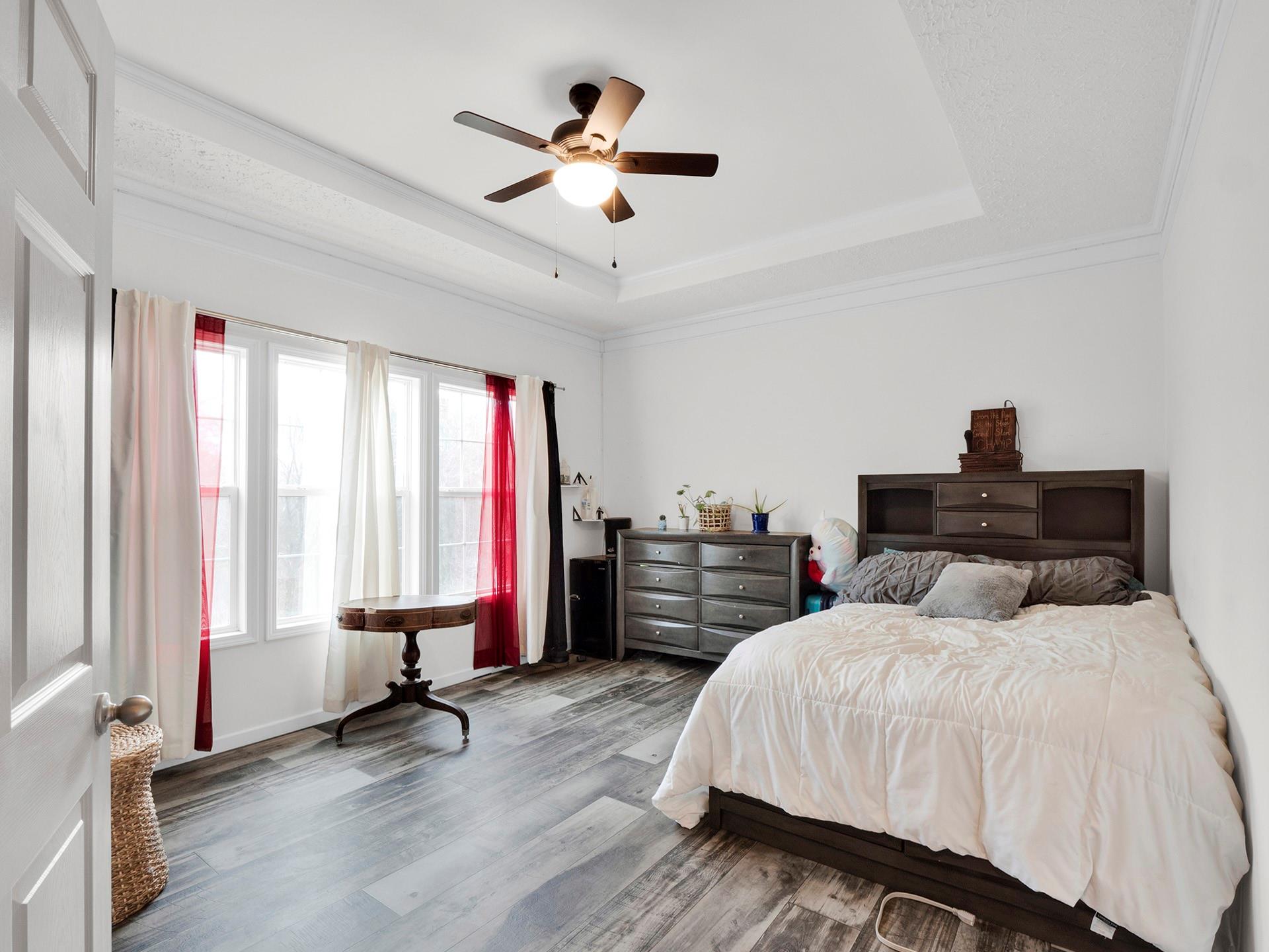 550 North Burris Road Sharon, SC 29742 - Photo 28 of 34 a bedroom with a bed and a chandelier