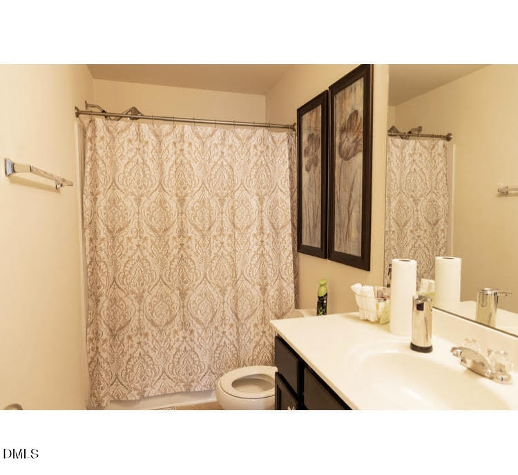 3904 Swinton Street Raleigh, NC 27616 - Photo 12 of 20 a bathroom with a sink and a mirror